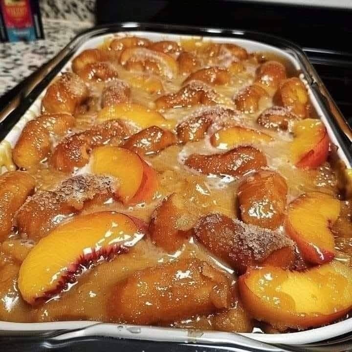 Krispy Kreme Peach Cobbler: The Ultimate Southern Dessert Fusion 🍑🍩 481023675_2061440374375812_9017364214367623479_n